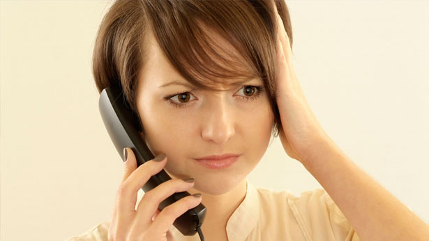 Angry-young-woman-with-a-phone-via-Shutterstock